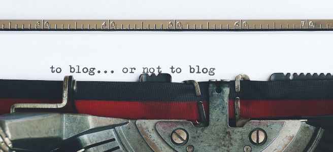 Picture of typewriter with "to blog...or not to blog" written on it